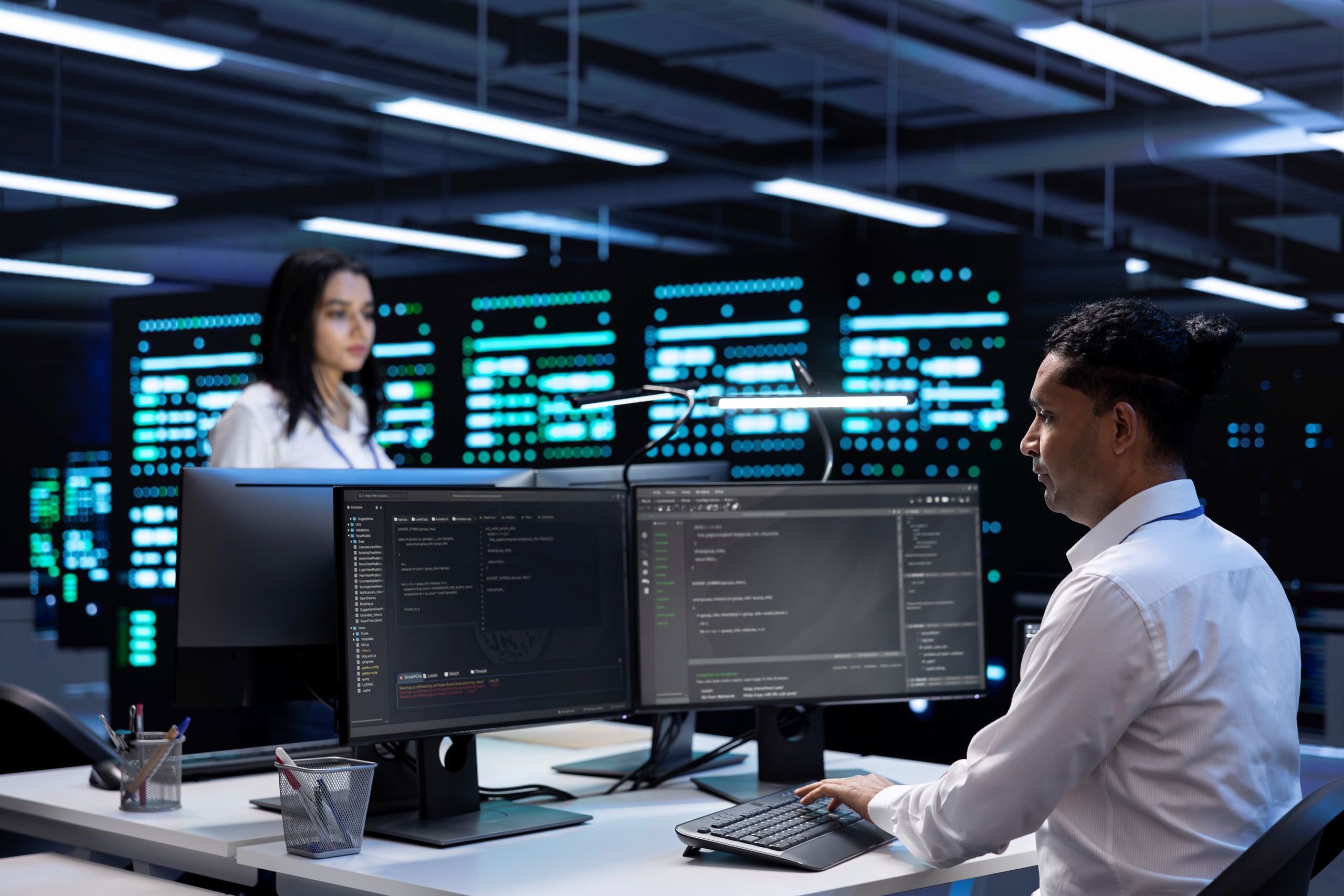 IT professionals working inside data center.